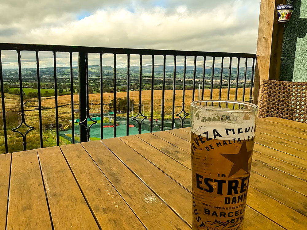 Enjoying a drink on the sheltered balcony of the Wellspings after the walk