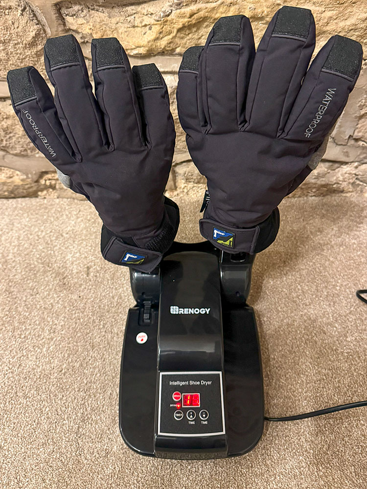 Gloves being dried on an electric boot dryer