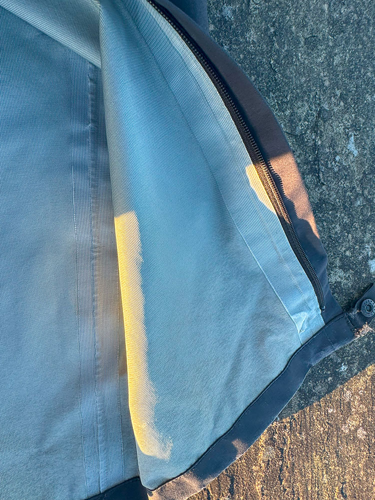 Taped seams inside waterproof trousers and alongside the zip