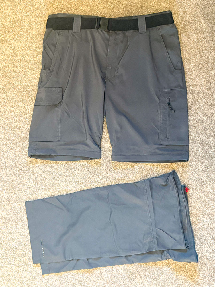 Convertible hiking trousers unzipped, so showing hiking shorts and the bottom half of the legs