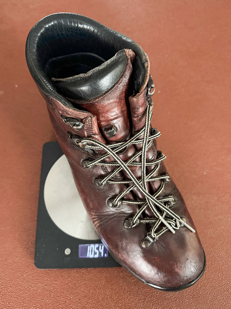 A heavyweight hiking boot on a scale weighing 2.1Kg for the pair