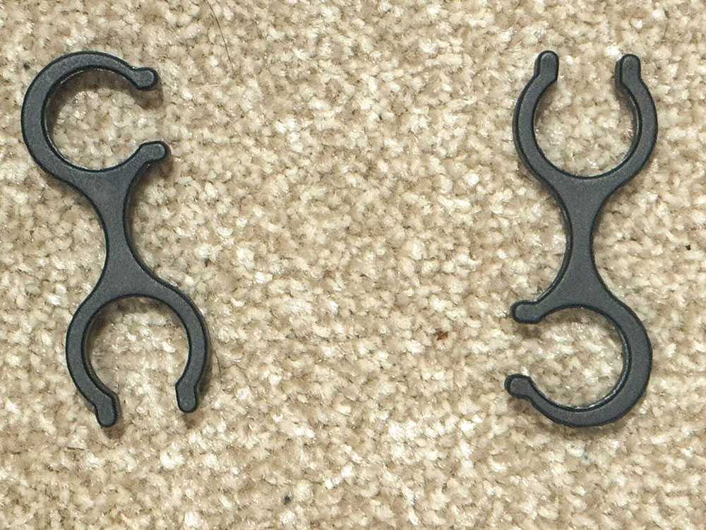 A pair of walking or hiking pole clips, that keep the poles together