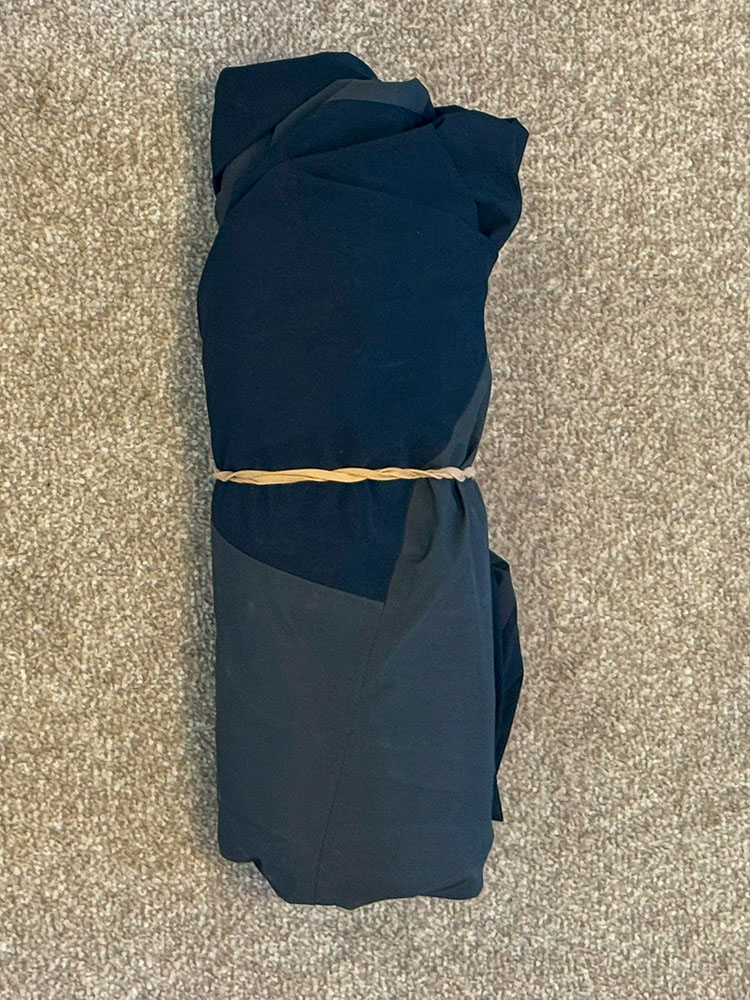 Mountain Equipment Lhotse jacket rolled and secured with a band