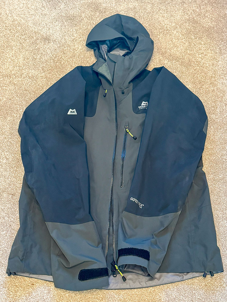 Mountain Equipment Lhotse jacket with arms folded inwards, ready for folding