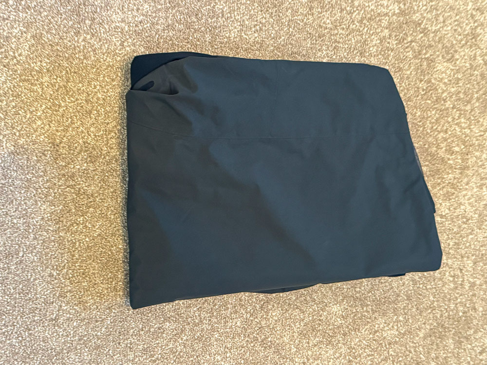 Mountain Equipment Lhotse waterproof jacket folded, ready for packing flat