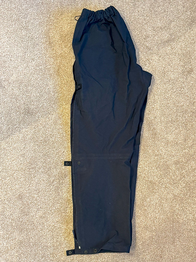 Waterproof trousers folded in half longways