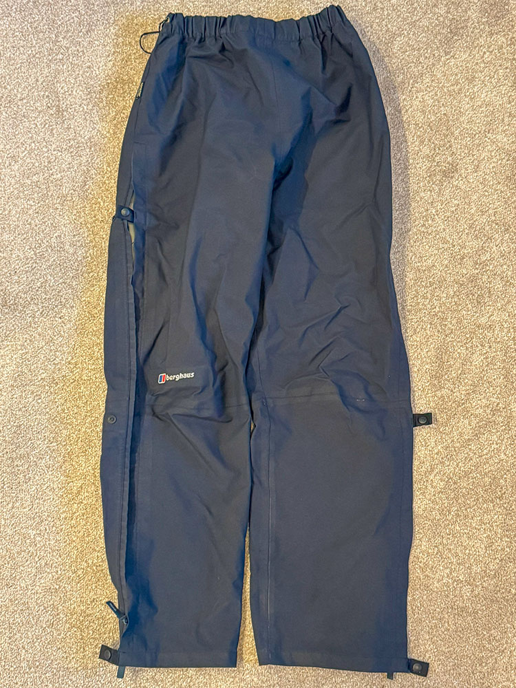 Waterproof trousers laid flat on the floor