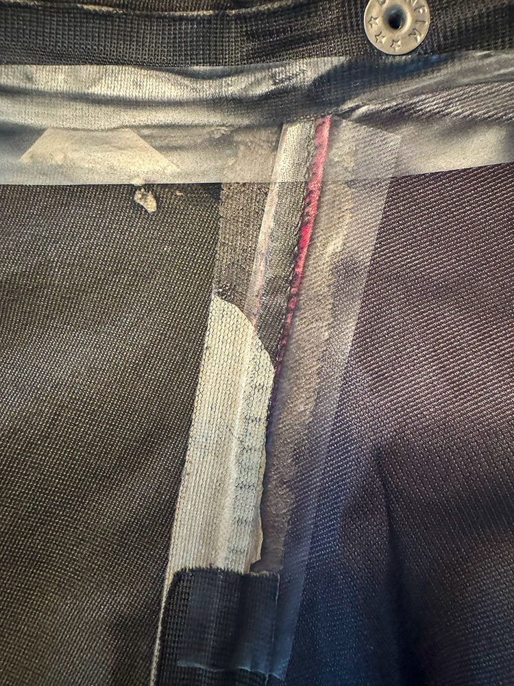 Repaired seam, with iron-on tape used to seal the seam