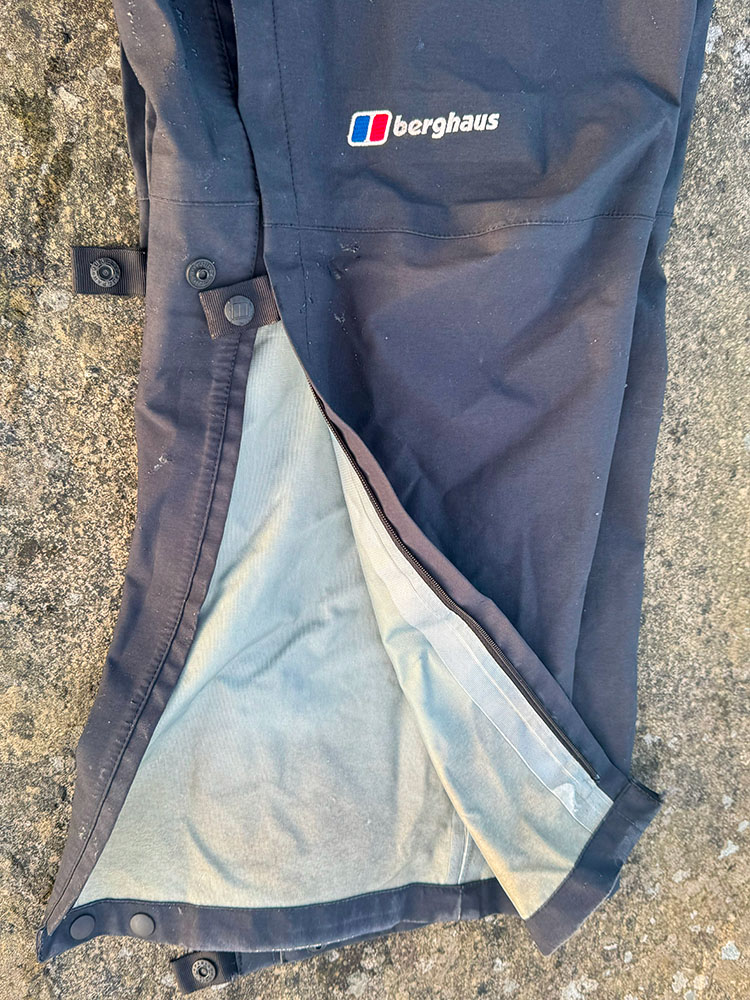 Storm flaps to protect the zips from water igress on waterproof trousers