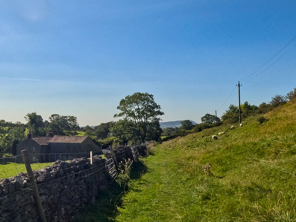 Heading alongside a wall, as the path heads towards Worsaw End House