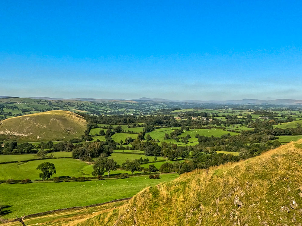 Looking back over Worsaw Hill, with Ingleborough and Pen-y-ghent to the right of it, on the horizon