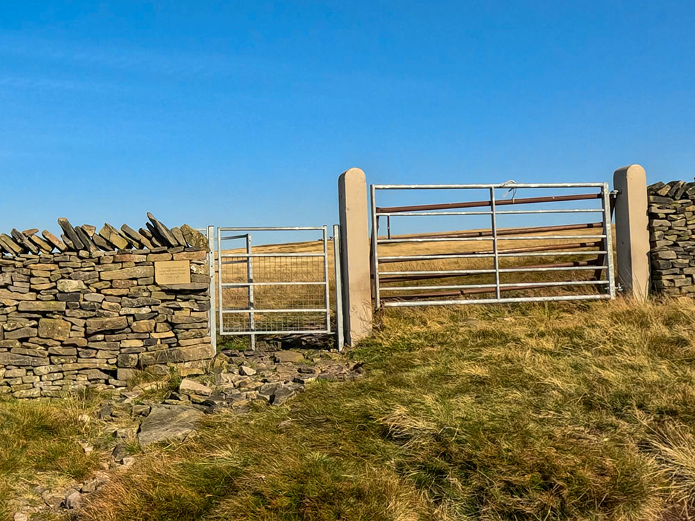 Just past the weather shelter, pass through the stile in the wall, and then head away diagonally right