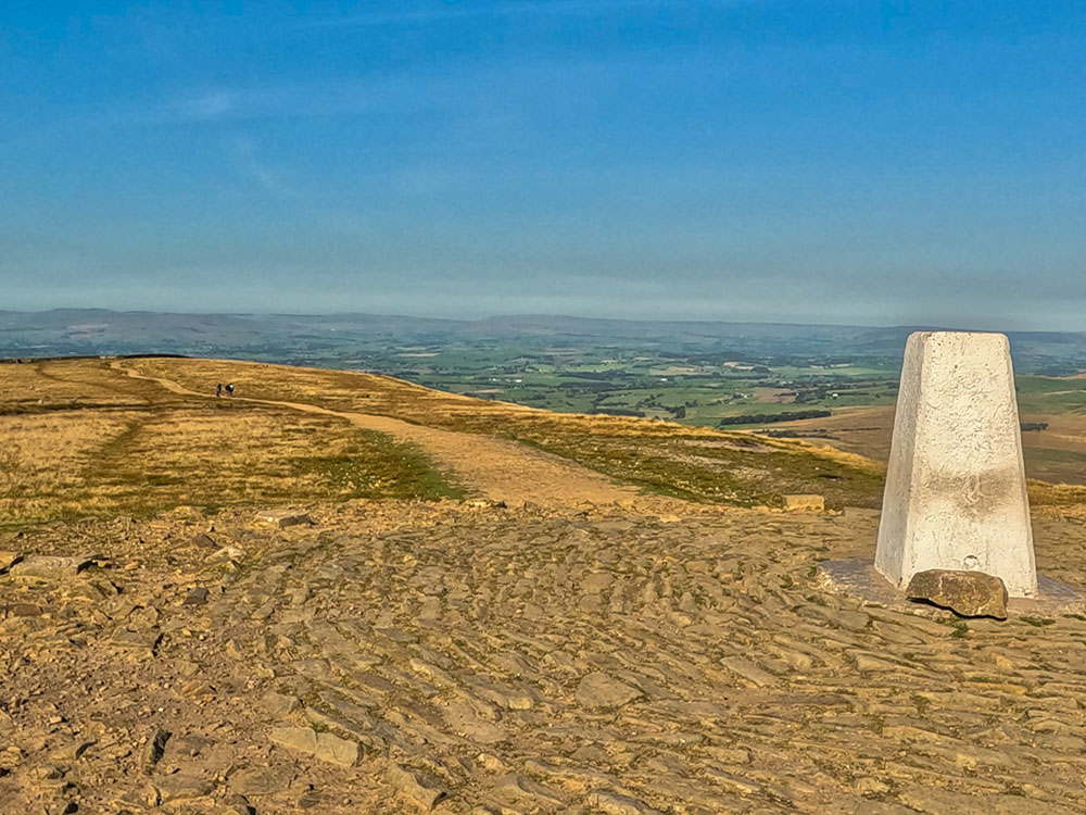 For the onward journey, the outbound path is reversed from the trig point back towards the wall