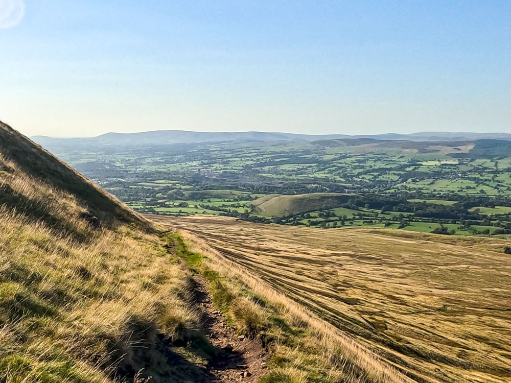 As the path bends around to the left, it starts to descend more steeply