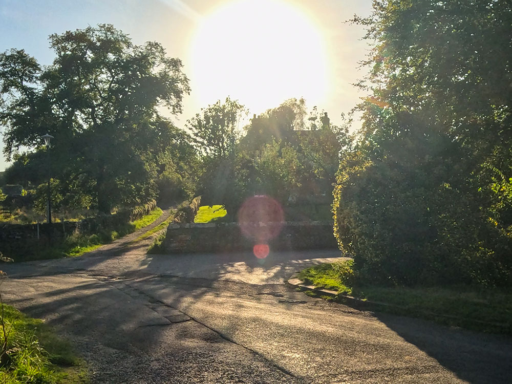 The right turn back into the car park, with the short track walked down at the start of the walk directly ahead