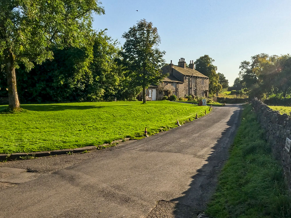 The road back towards the car park in Downham past the ice cream shop