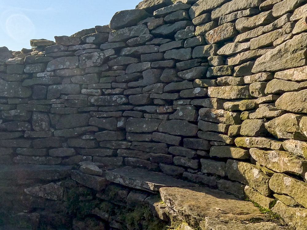 The seat inside the weather shelter on Pendle Hill