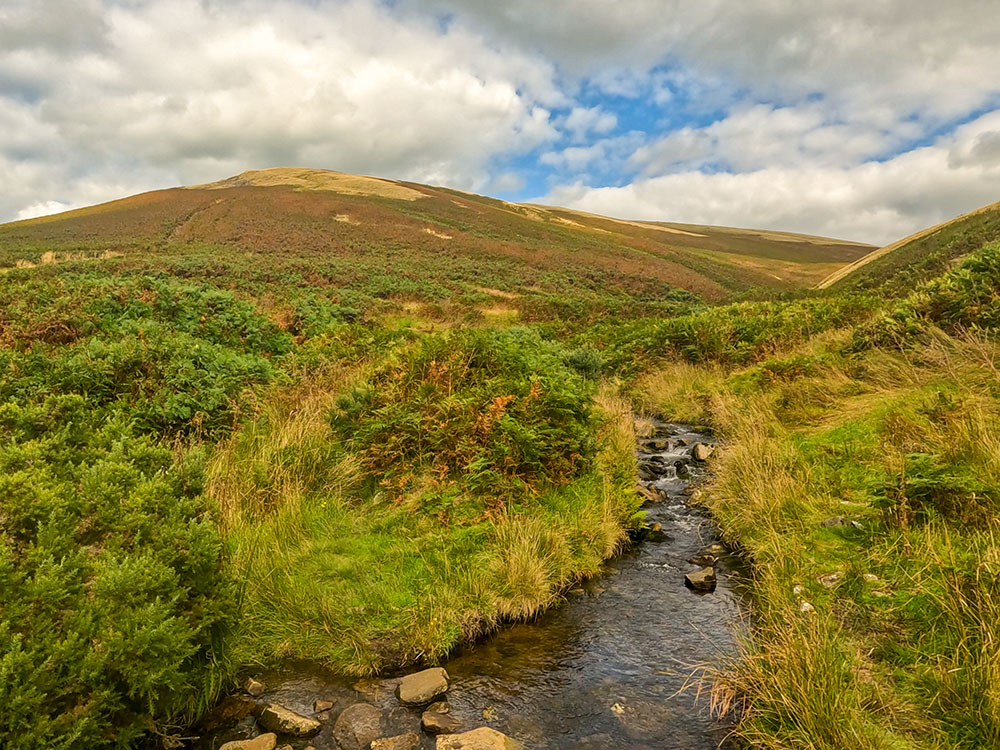 Looking back over Howcroft Brook up towards the path just taken to descend from Mearley Moor