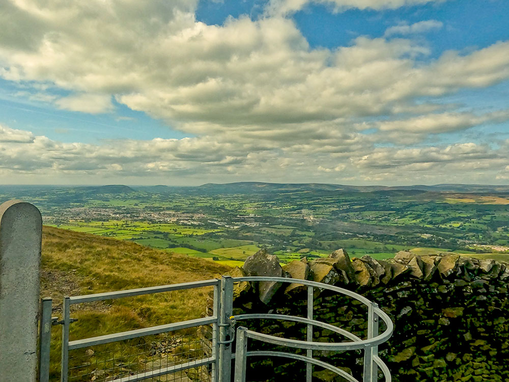 Pass through the metal kissing gate with views out over the Ribble Valley