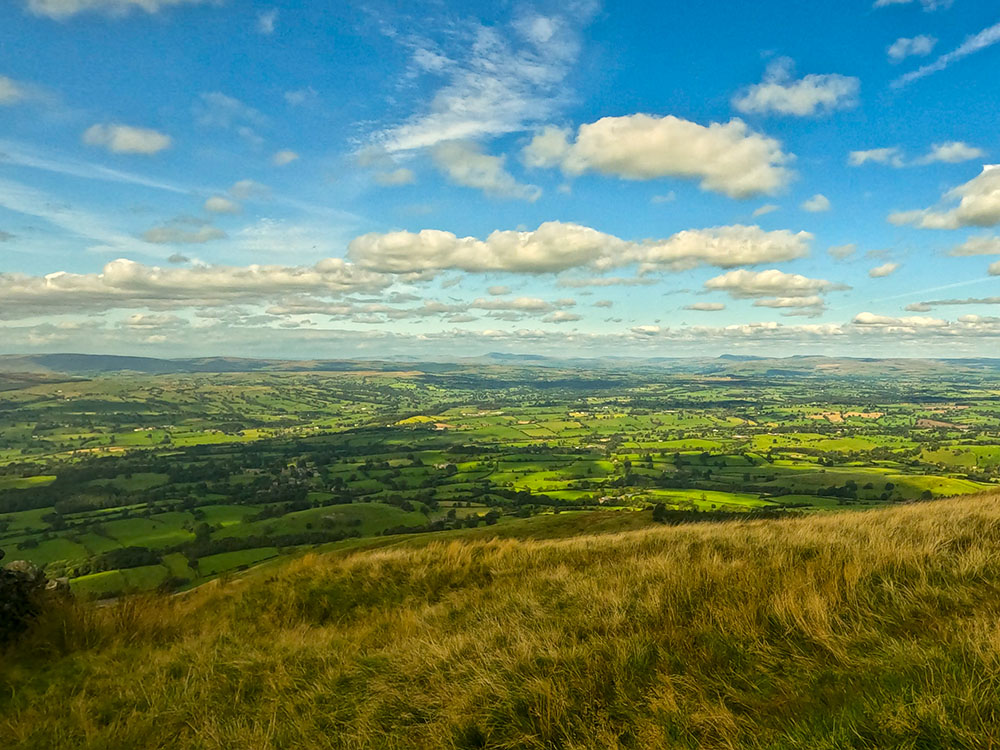 Looking towards the Southern Lakeland Fells and the Yorkshire Dales from the metal kissing gate