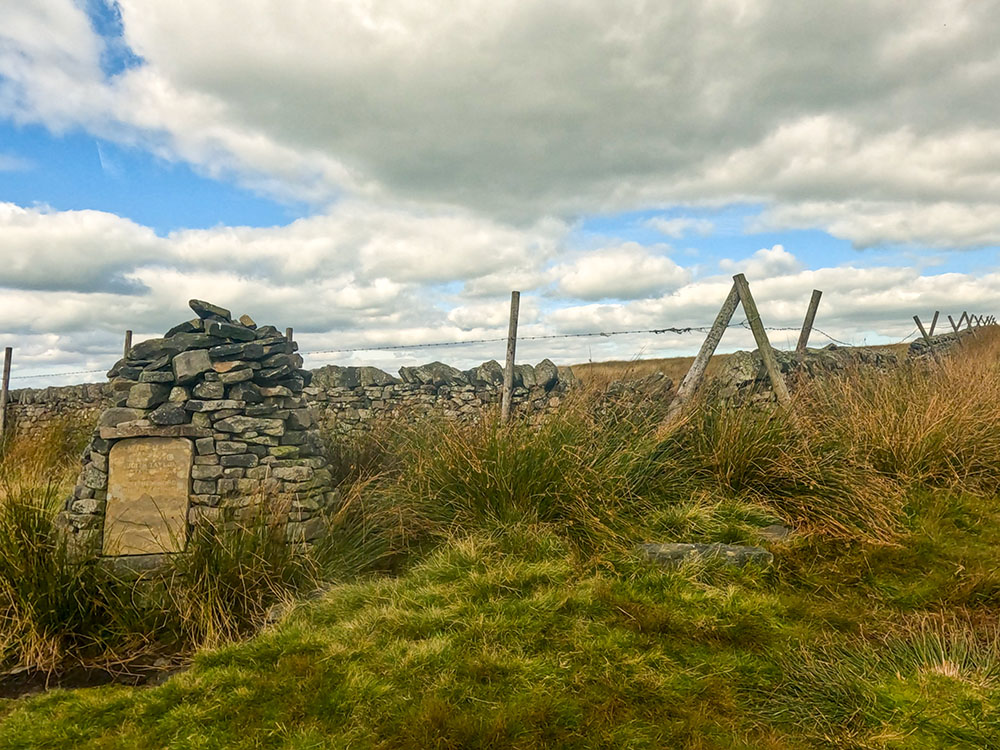 Memorial Cairn on the corner of the wall