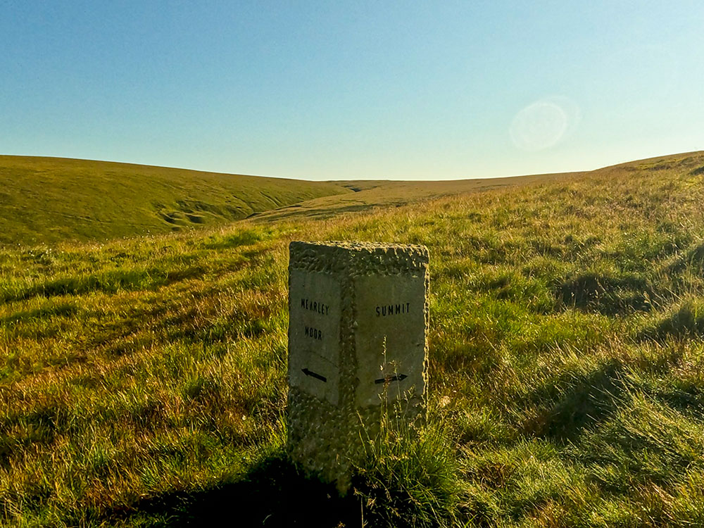 Stone waymarker, showing left towards Mearley Moor and straight on towards the summit of Pendle Hill