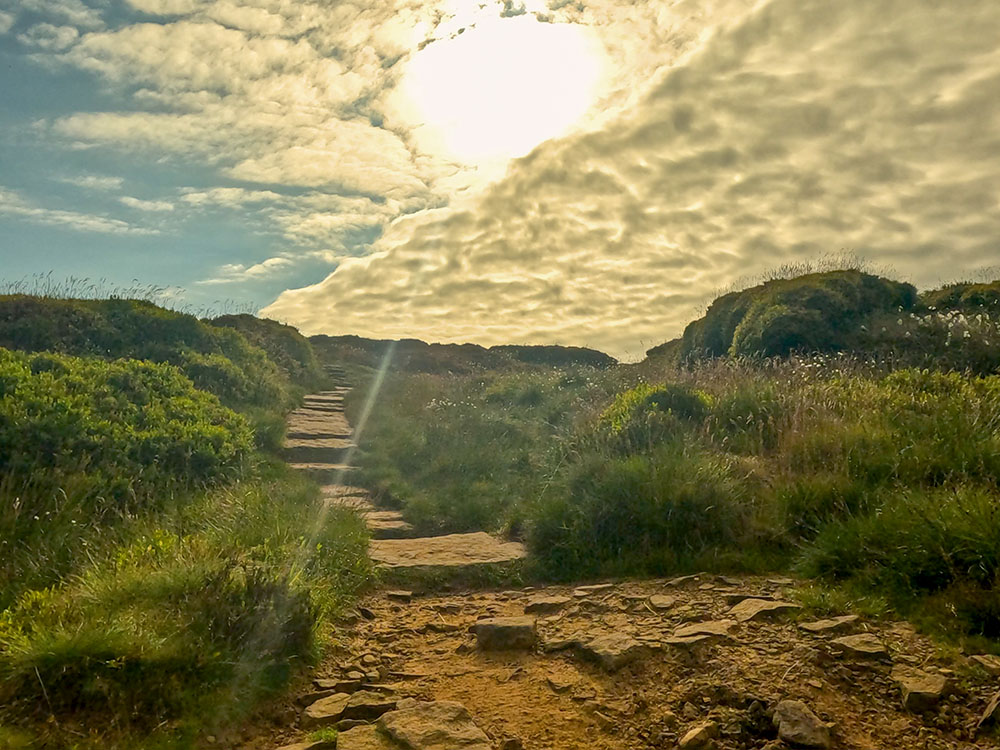 The footpath soon becomes paved underfoot