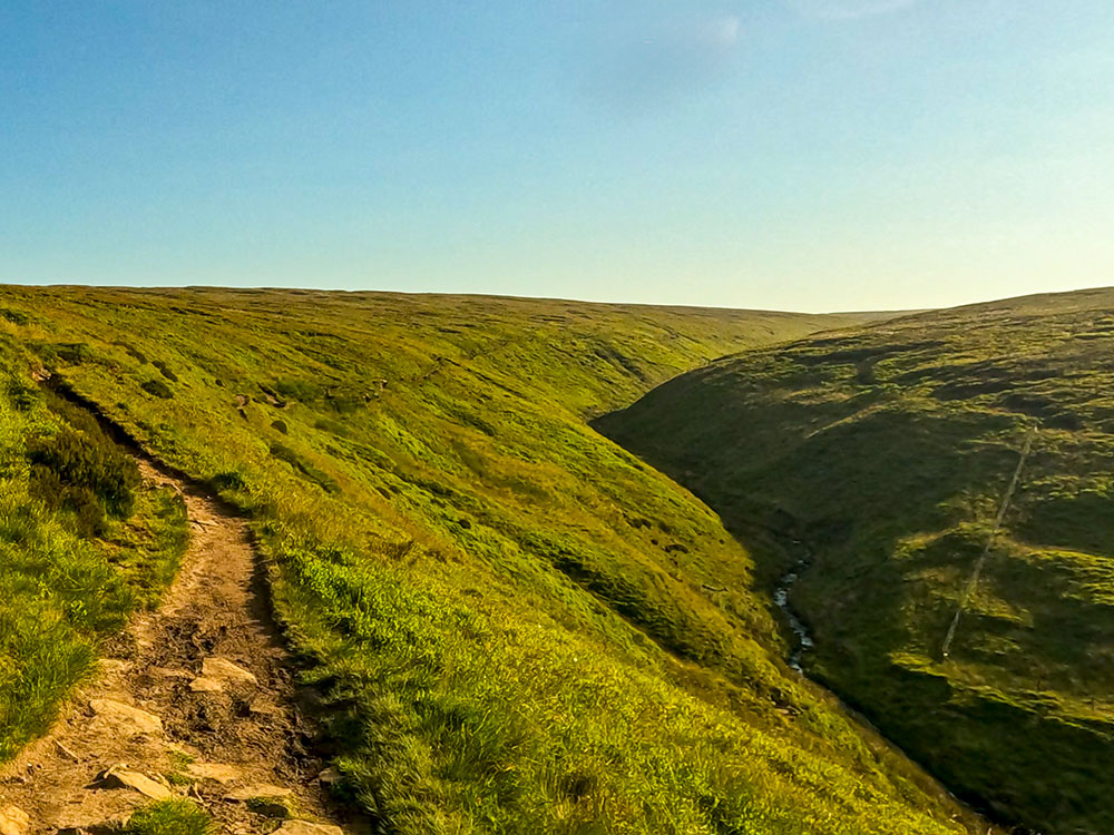 The path pulls in alongside Ogden Clough