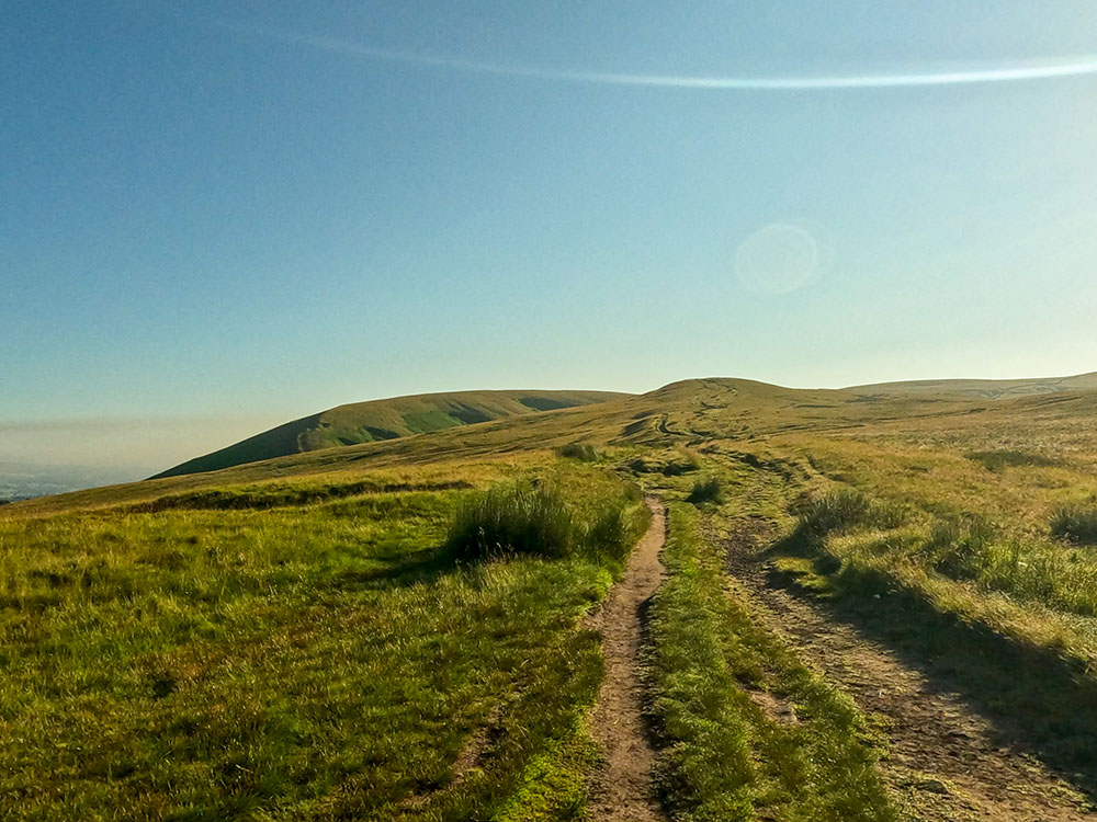 The wide path heads towards Apronfull Hill on Pendle Hill